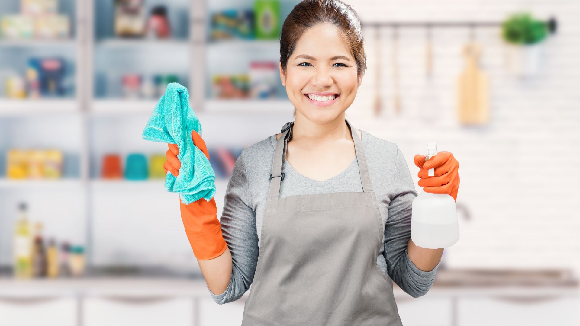 Female cleaner holding cleaning equipment