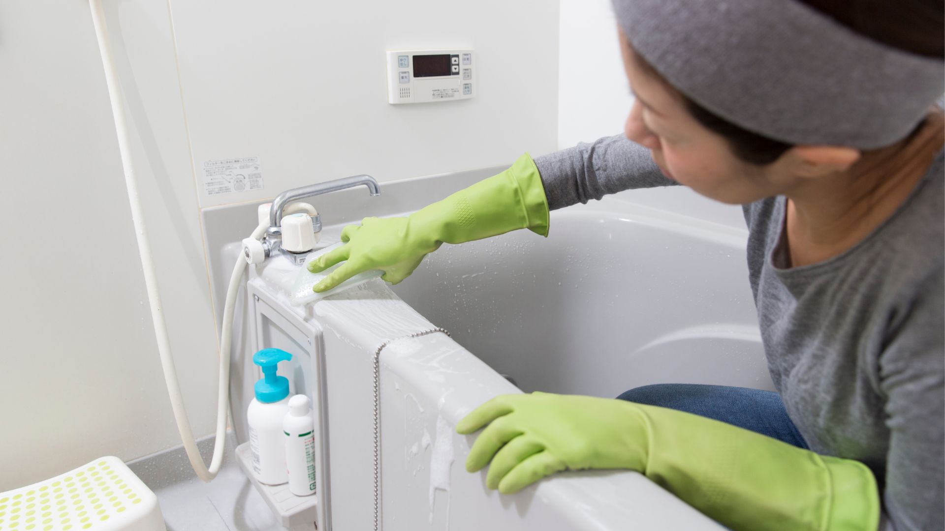 Maid cleaning bathroom