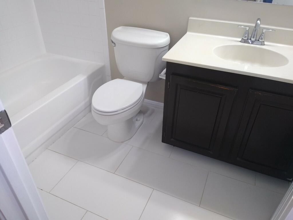 Elegant bathroom with toilet and vanity