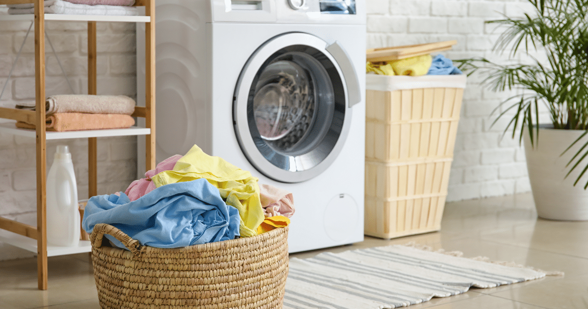 Laundry area with bucket of clothes