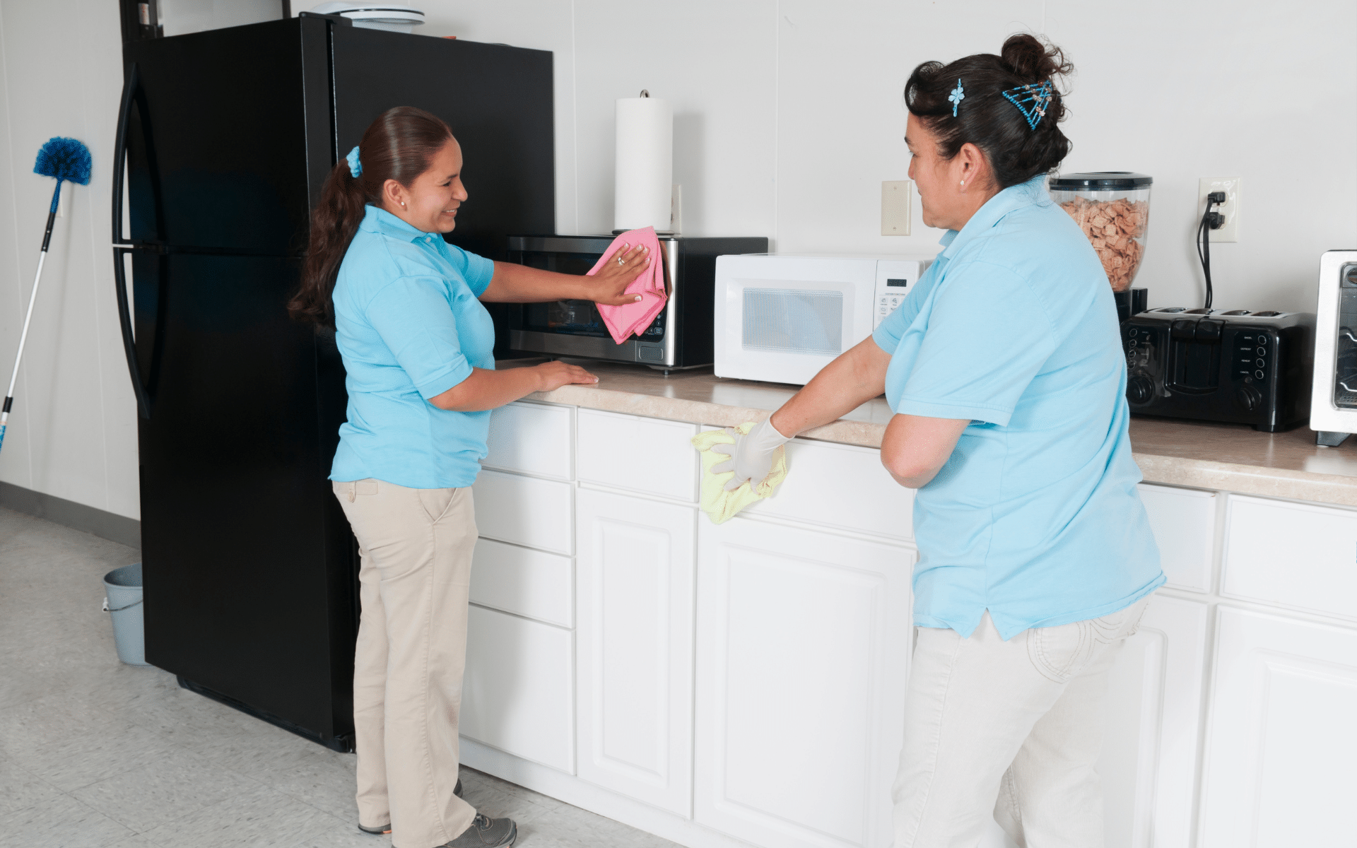 2 maid cleaning office kitchen