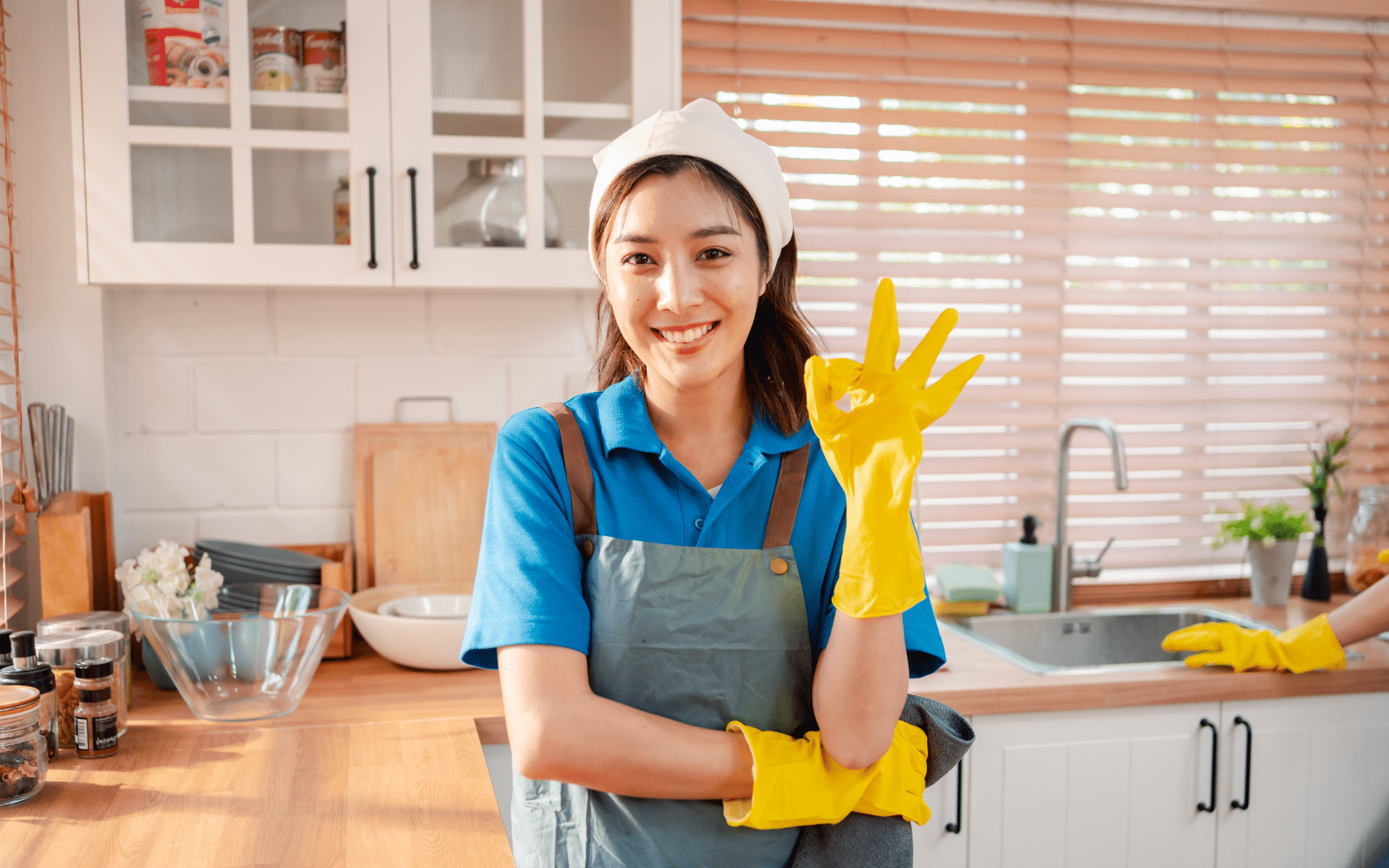 Maid cleaner in kitchen