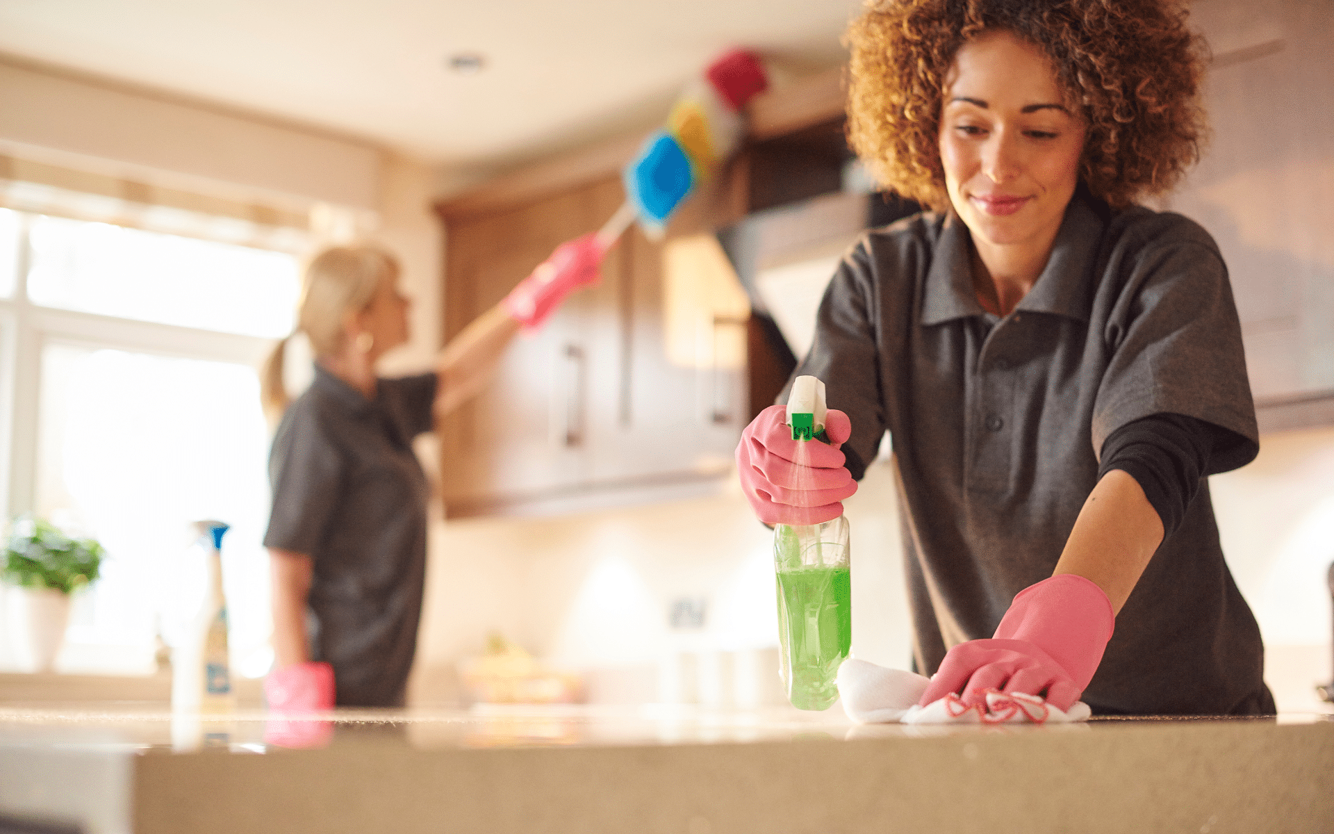2 maid cleaner in the kitchen