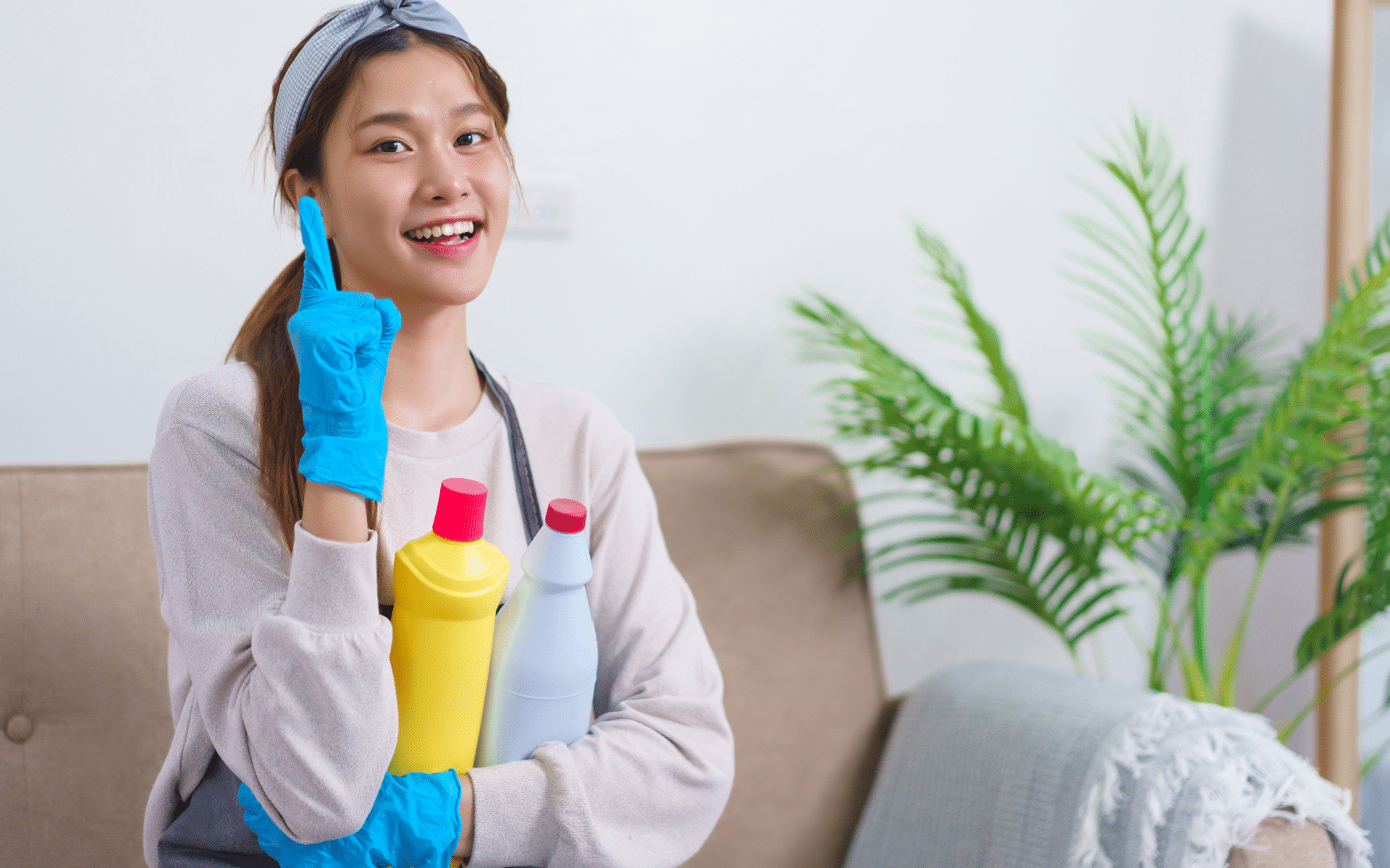 Female maid cleaner sitting in sofa